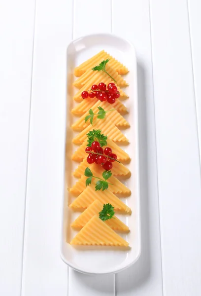 Semi-hard cheese triangles — Stock Photo, Image