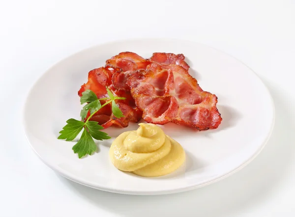 Knaperstekt bacon med senap — Stockfoto