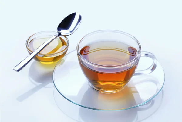 Taza de té y miel —  Fotos de Stock