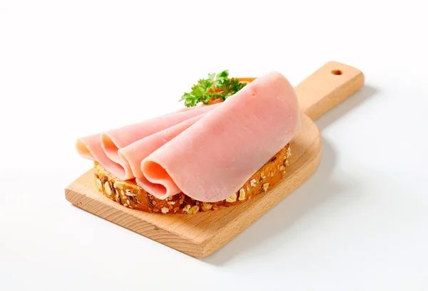 Bread with sliced ham — Stock Photo, Image