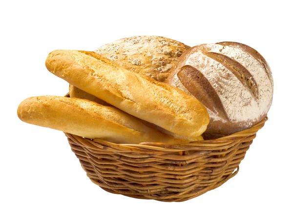 Bread loaves and baguettes in a basket — Stock Photo, Image