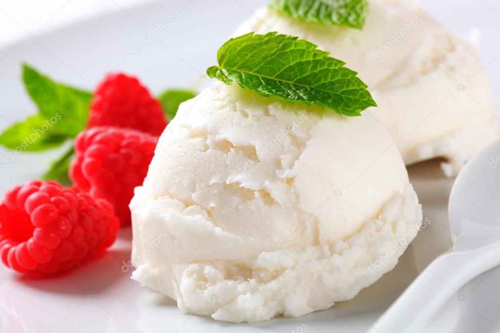Scoop of creamy ice cream with raspberries