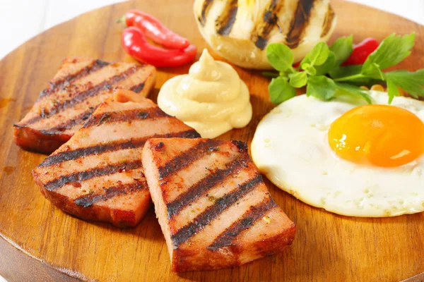 Grilled Leberkase with fried egg and mustard — Stock Photo, Image