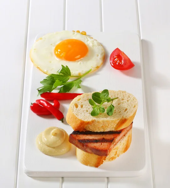 Grilled Leberkase sandwich with mustard and fried egg — Stock Photo, Image