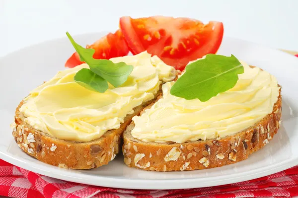 Whole grain bread with butter — Stock Photo, Image