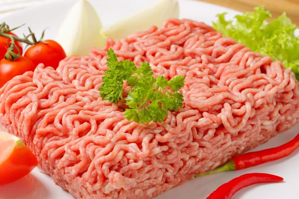 Raw ground pork and vegetables — Stock Photo, Image