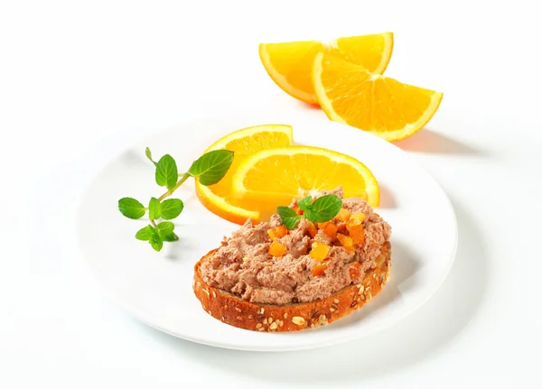 Bread with meat spread — Stock Photo, Image