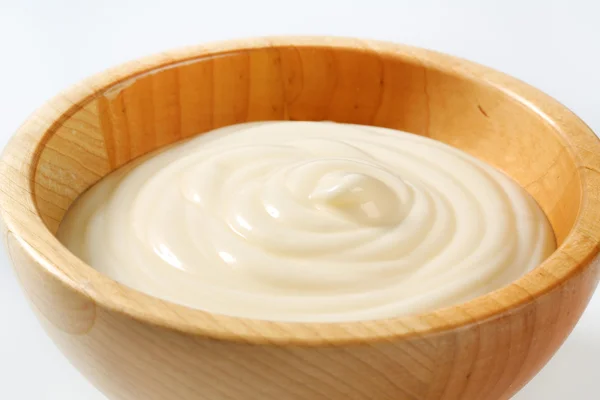 Creamy sauce in wooden bowl — Stock Photo, Image