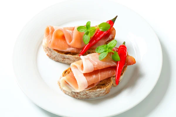 Prosciutto open faced sandwiches — Stock Photo, Image