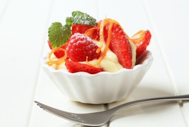Creamy pudding with fresh fruit clipart