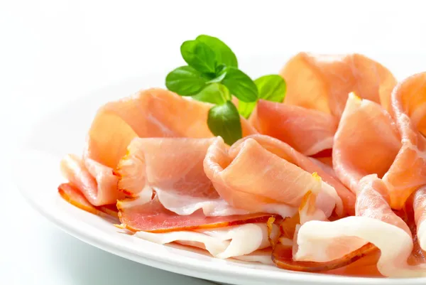 Thinly sliced prosciutto — Stock Photo, Image