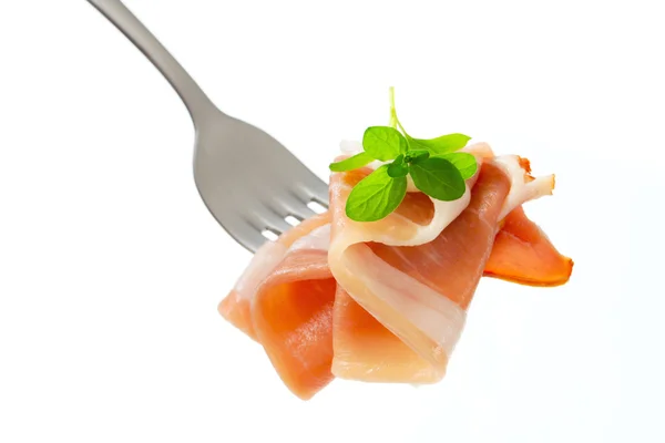 Prosciutto on a fork — Stock Photo, Image