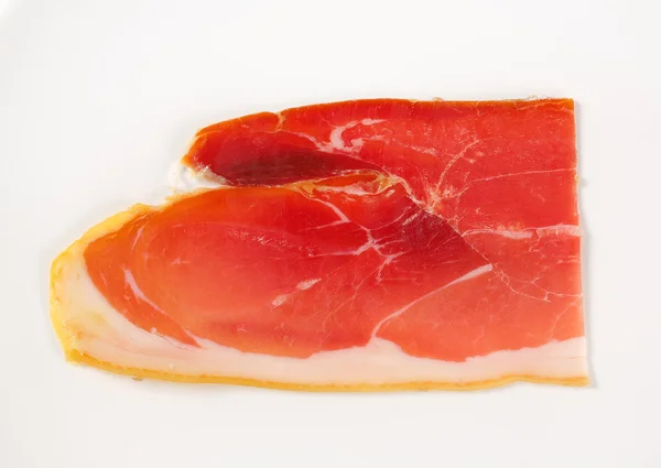 Kawałek prosciutto crudo — Zdjęcie stockowe