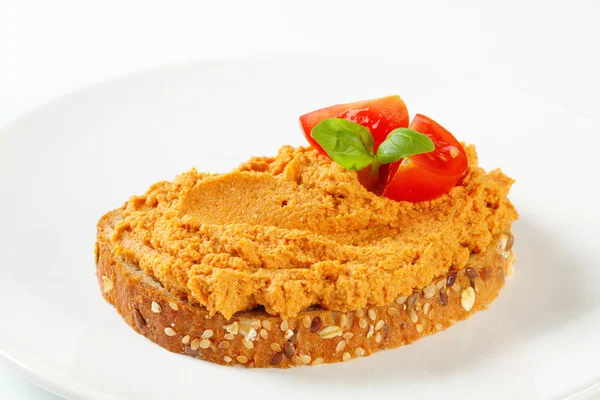 Bread with tomato spread — Stock Photo, Image