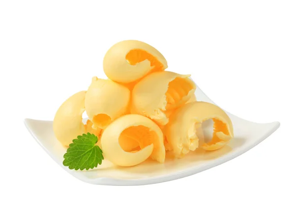 Butter curls on plate — Stock Photo, Image