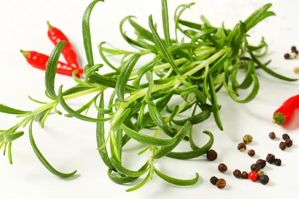 Rosemary, peppercorns and red chili peppers — Stock Photo, Image