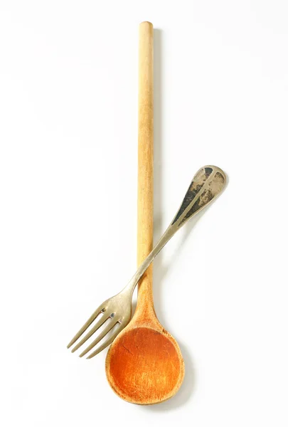 Wooden spoon and metal fork — Stock Photo, Image
