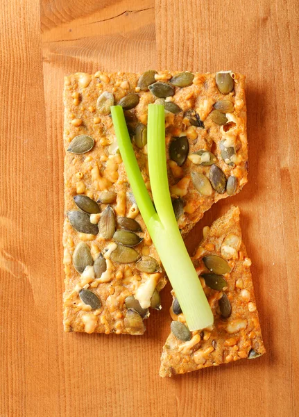 Cheese cracker with pumpkin seeds — Stock Photo, Image