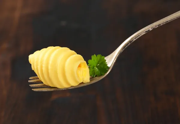 Masło curl na widelec — Zdjęcie stockowe