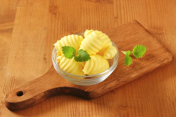 Bowl of butter curls — Stock Photo, Image