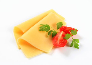 Sliced cheese and tomato wedges clipart