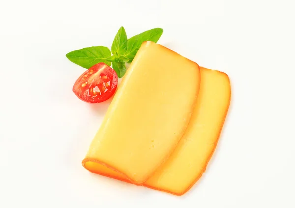 Slice of smoked cheese — Stock Photo, Image