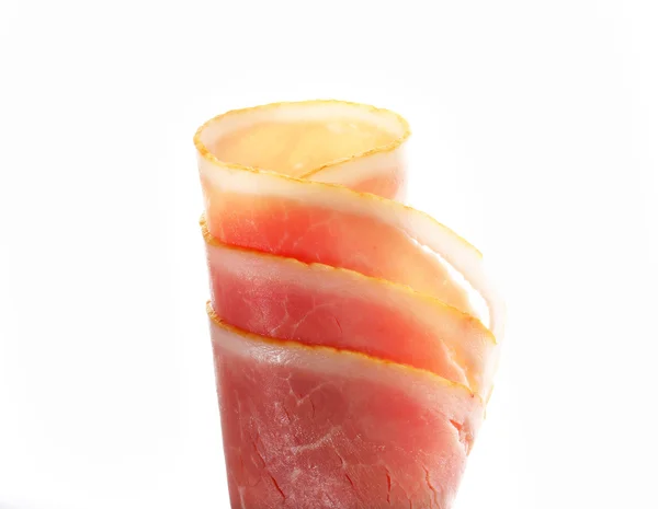 Thin slices of cooked ham, rolled up — Stock Photo, Image