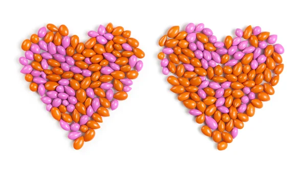 Two hearts made from dragee candies — Stock Photo, Image