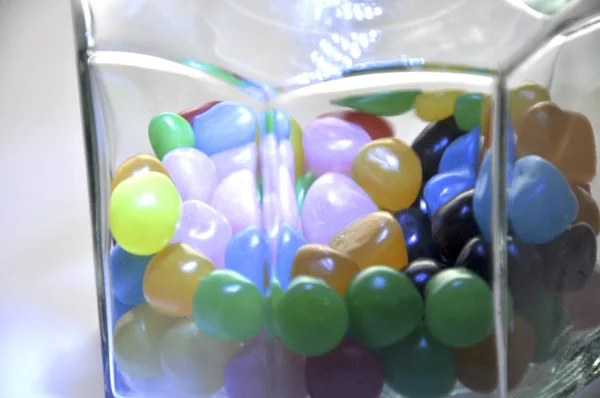 Colored candy in a glass jar — Stock Photo, Image