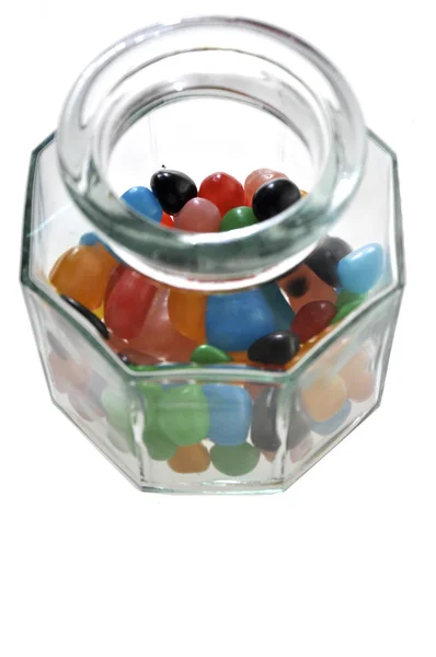 Colored candy in a glass jar — Stock Photo, Image