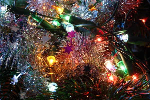 Glowing Christmas electric garland, closeup. — Stock Photo, Image