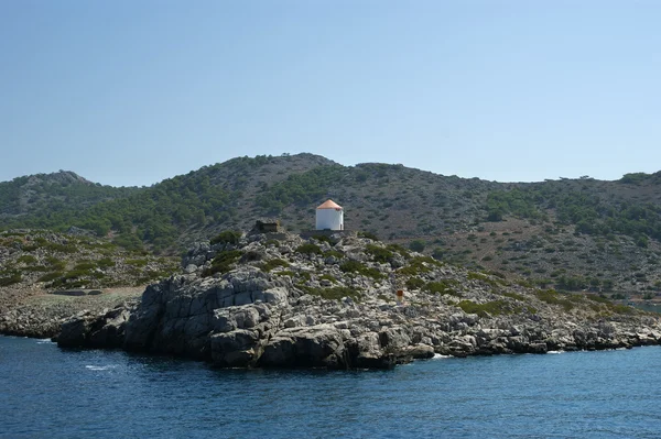 Old windmill on the shore of one of the Greek islands — Stock Photo, Image