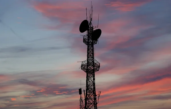 Communication transmitter against a sky background — Stock Photo, Image