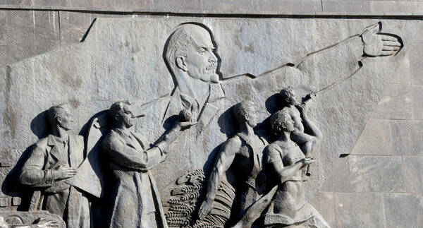 Detail from the titanium obelisk representing the Soviet succes dream, featuring scientists and engineers hard at work. Monument of Sovjet space flight, near VDNK exhibition center, Moscow, Russia
