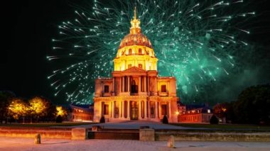 Celebratory colorful fireworks over the Les Invalides (The National Residence of the Invalids) at night. Paris, France