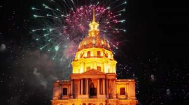 Celebratory colorful fireworks over the Les Invalides (The National Residence of the Invalids) at night. Paris, France