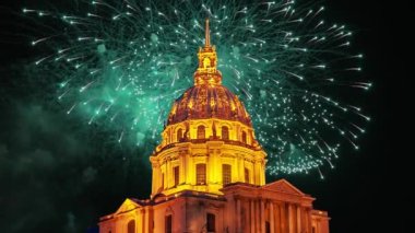 Celebratory colorful fireworks over the Les Invalides (The National Residence of the Invalids) at night. Paris, France