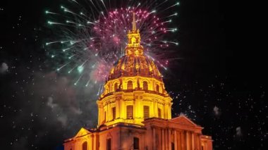 Celebratory colorful fireworks over the Les Invalides (The National Residence of the Invalids) at night. Paris, France