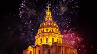 Celebratory colorful fireworks over the Les Invalides (The National Residence of the Invalids) at night. Paris, France