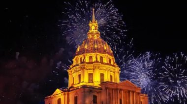 Celebratory colorful fireworks over the Les Invalides (The National Residence of the Invalids) at night. Paris, France
