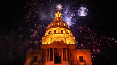 Celebratory colorful fireworks over the Les Invalides (The National Residence of the Invalids) at night. Paris, France