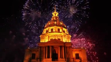Celebratory colorful fireworks over the Les Invalides (The National Residence of the Invalids) at night. Paris, France