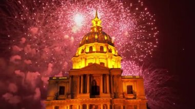 Celebratory colorful fireworks over the Les Invalides (The National Residence of the Invalids) at night. Paris, France