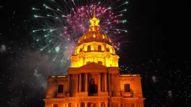 Celebratory colorful fireworks over the Les Invalides (The National Residence of the Invalids) at night. Paris, France