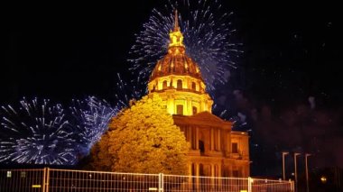 Celebratory colorful fireworks over the Les Invalides (The National Residence of the Invalids) at night. Paris, France