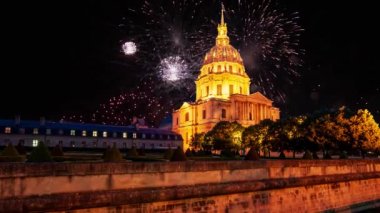 Celebratory colorful fireworks over the Les Invalides (The National Residence of the Invalids) at night. Paris, France
