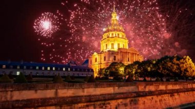 Celebratory colorful fireworks over the Les Invalides (The National Residence of the Invalids) at night. Paris, France