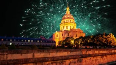 Celebratory colorful fireworks over the Les Invalides (The National Residence of the Invalids) at night. Paris, France