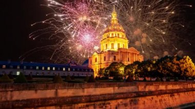 Celebratory colorful fireworks over the Les Invalides (The National Residence of the Invalids) at night. Paris, France