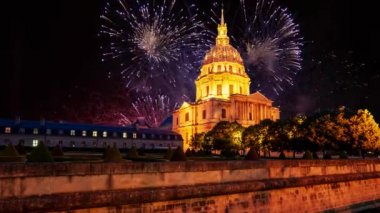 Celebratory colorful fireworks over the Les Invalides (The National Residence of the Invalids) at night. Paris, France